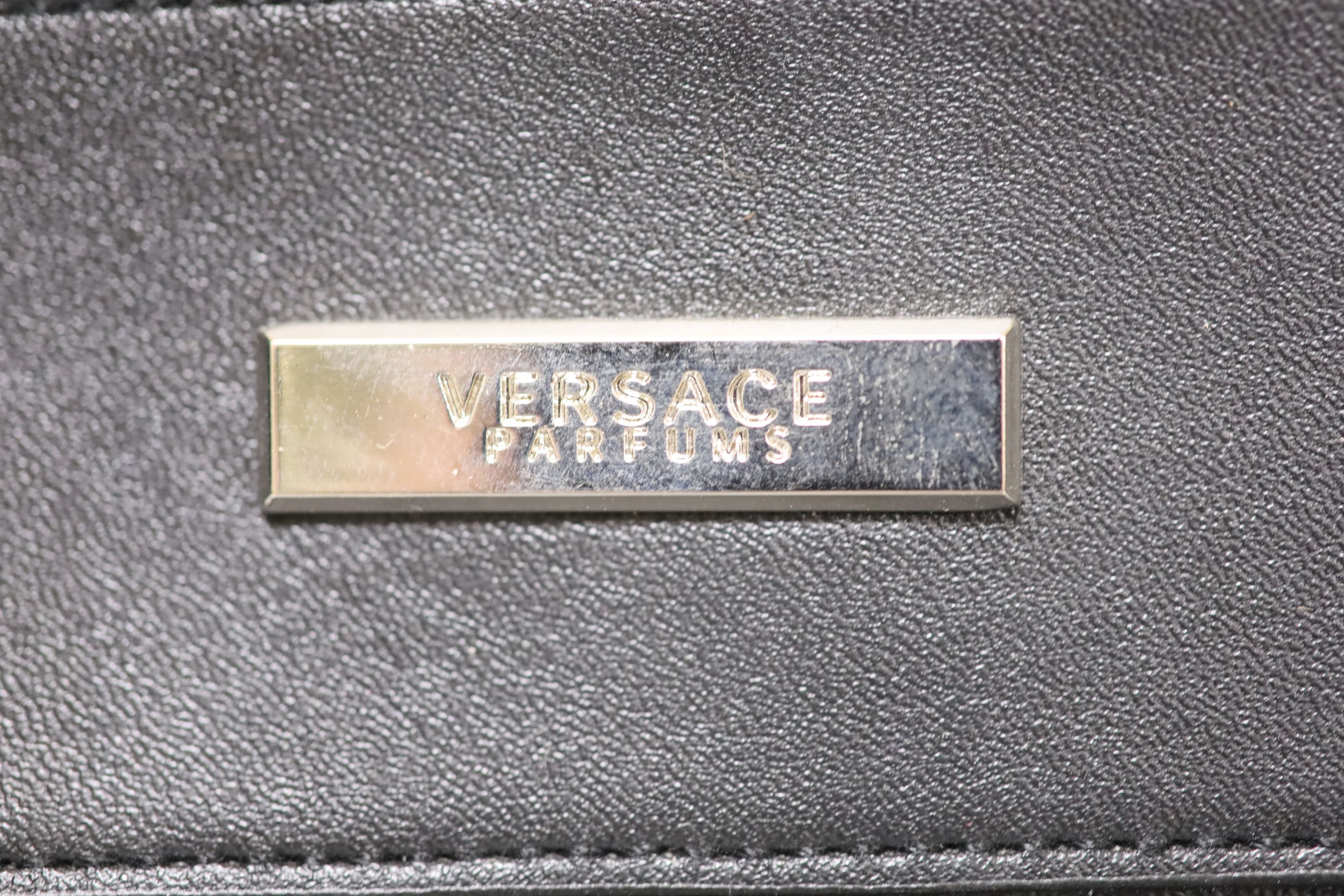 A Versace Parfums duffel bag